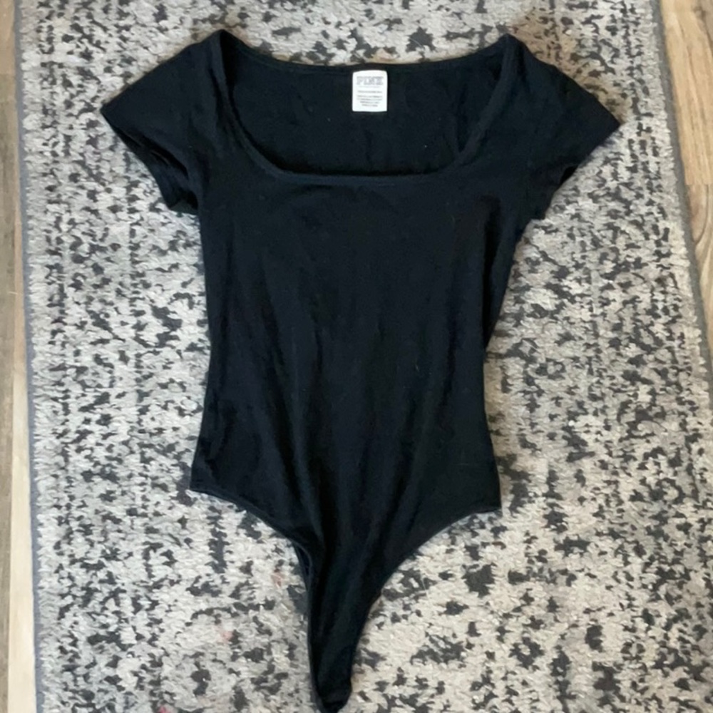 Pink Victoria’s Secret body suit
